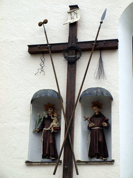 Old wooden cross and religious figures