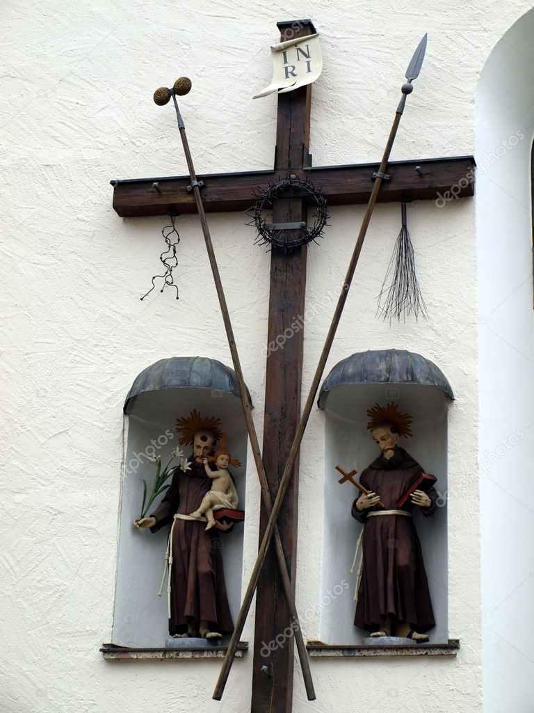 Old wooden cross and religious figures
