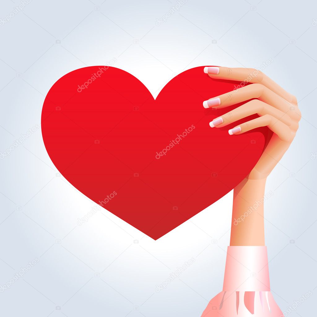 Female's hand holds heart shape