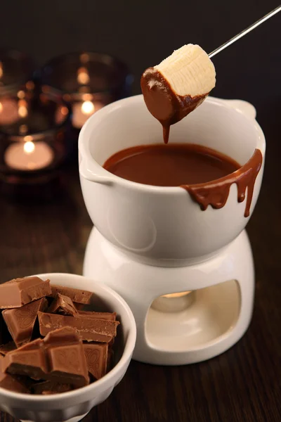 Dipping into chocolate fondue — Stock Photo, Image