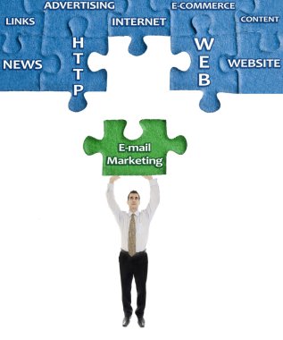 E-mail Marketing word on puzzle in man hands clipart