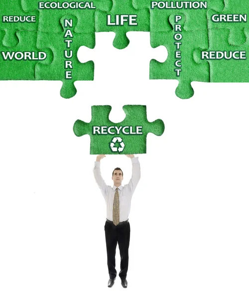 Recycle word on puzzle in man hands — Stock Photo, Image