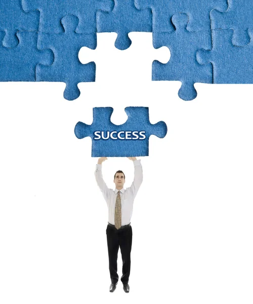 Success word on puzzle in man hands — Stock Photo, Image