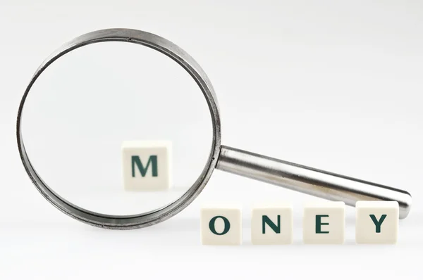 Money word and magnifying glass — Stock Photo, Image