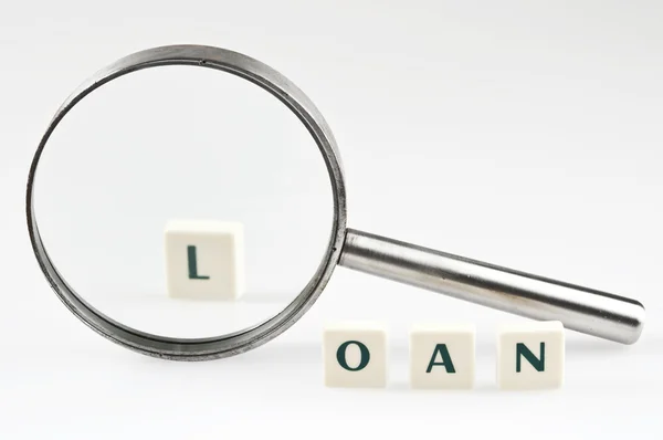 Loan word and magnifying glass — Stock Photo, Image