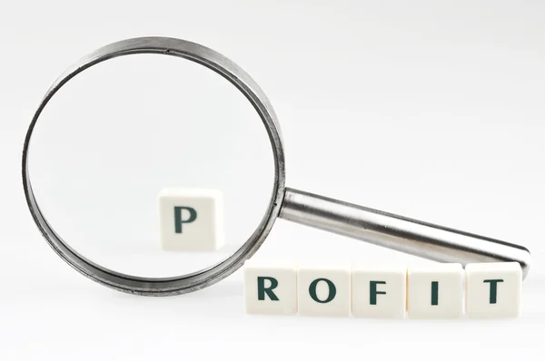 Profit word and magnifying glass — Stock Photo, Image