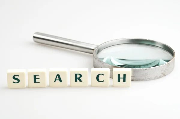 Search word and magnifying glass — Stock Photo, Image