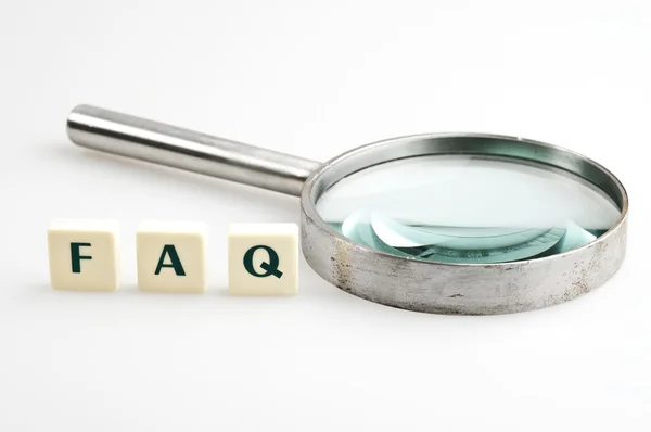 FAQ word and magnifying glass — Stock Photo, Image