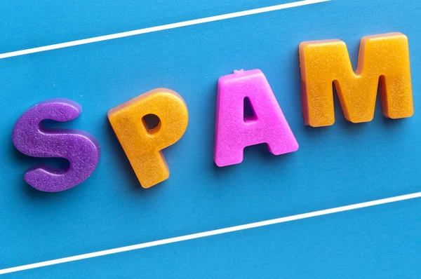 Mavi Pano üzerinde spam kelime — Stok fotoğraf