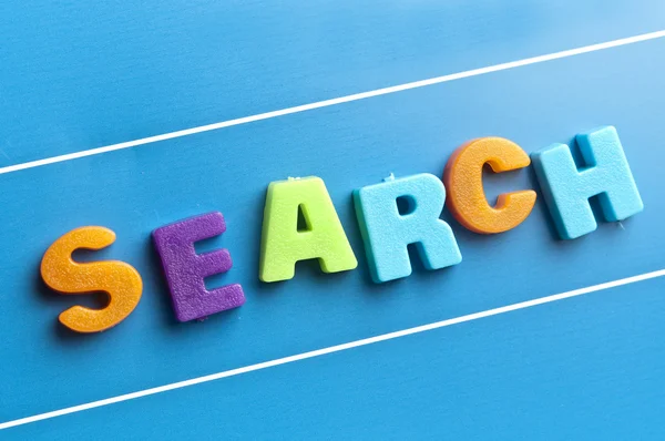 Search word on blue board — Stock Photo, Image