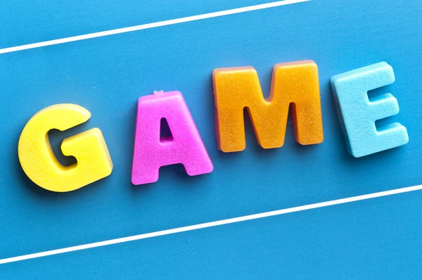 Palabra del juego en tablero azul — Foto de Stock
