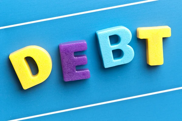 Debt word on blue board — Stock Photo, Image