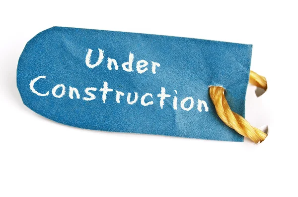 Under Construction word on label — Stock Photo, Image