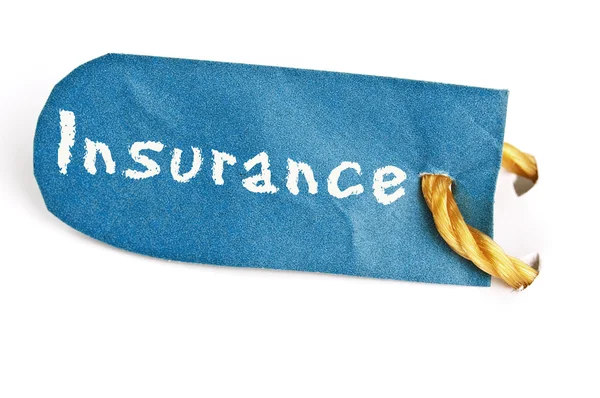 Palabra de seguro en la etiqueta — Foto de Stock