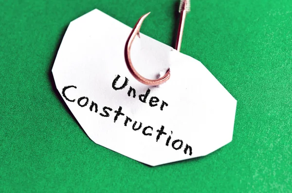 Under Construction message on paper — Stock Photo, Image