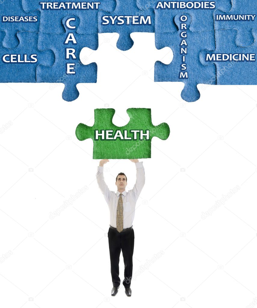 Health word on puzzle in man hands