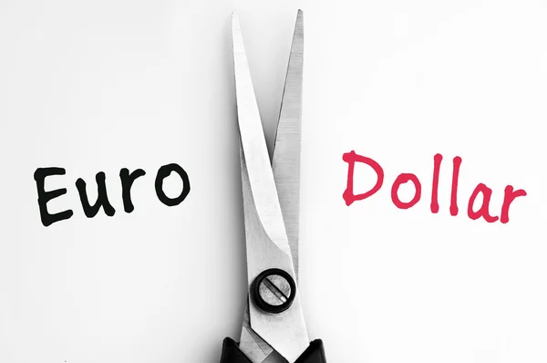 Euro and Dollar words with scissors in middle — Stock Photo, Image