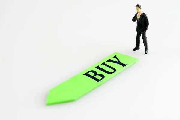Buy direction and toy business man — Stock Photo, Image