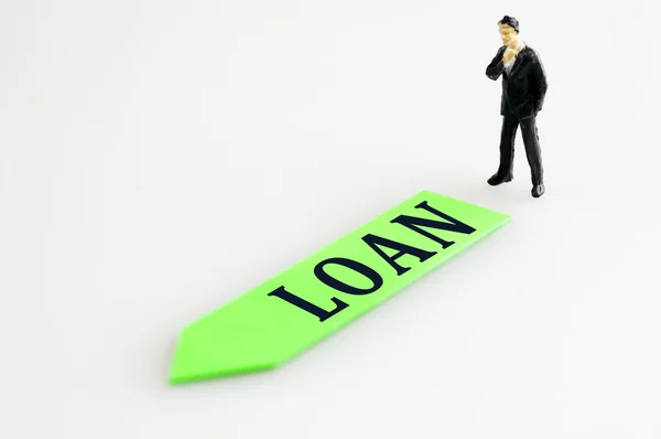 Loan direction and toy business man — Stock Photo, Image