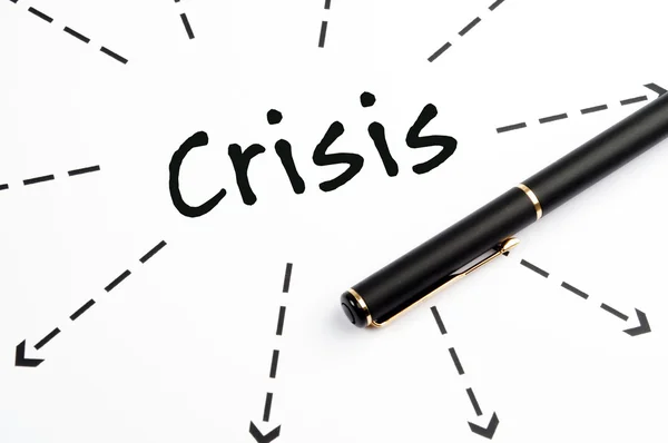 Palavra de crise wih setas e caneta — Fotografia de Stock