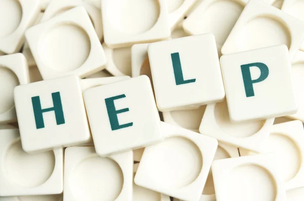 Help word made by leter pieces — Stock Photo, Image