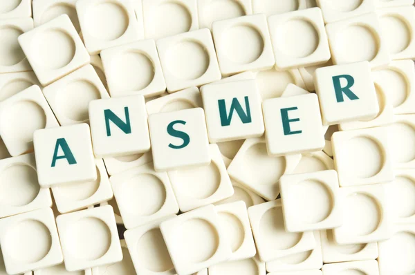 Answer word made by leter pieces — Stock Photo, Image