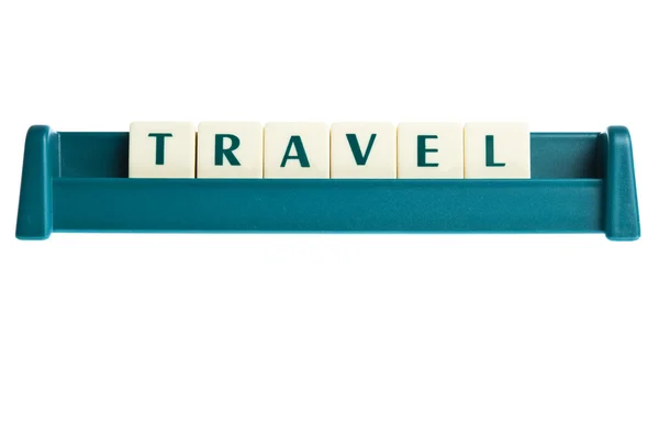 Reisewort auf isolierter Buchstabentafel — Stockfoto