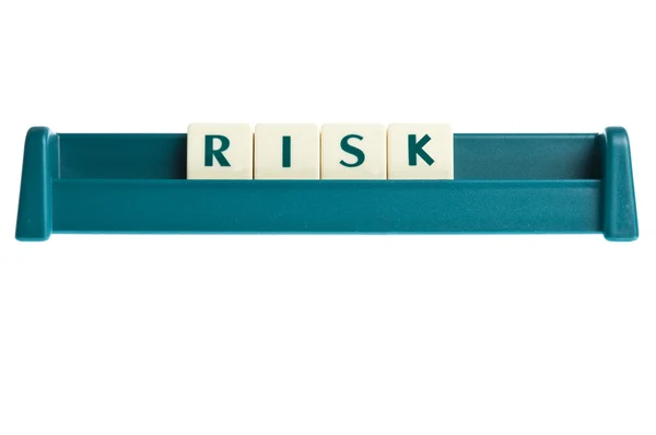 Risico woord op geïsoleerde brieven bord — Stockfoto