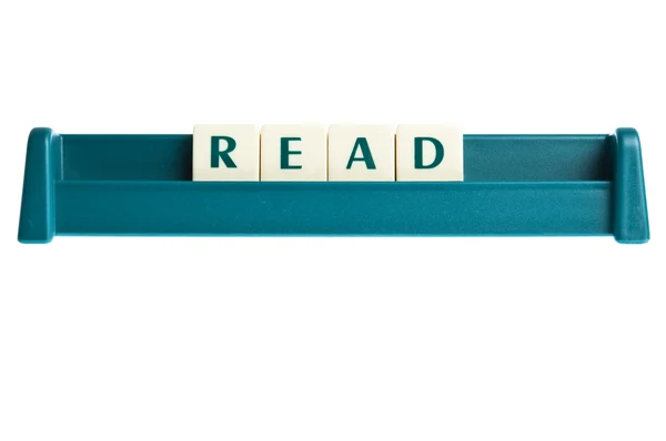 Woord op geïsoleerde brieven bord lezen — Stockfoto