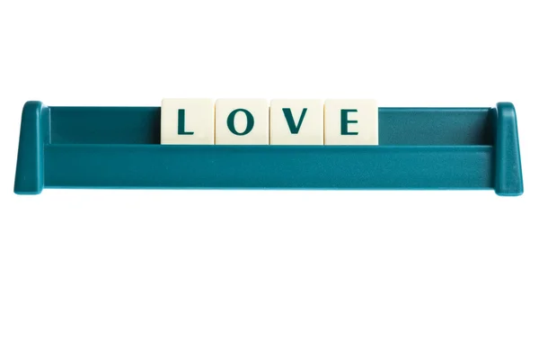 Liebeswort auf isolierter Buchstabentafel — Stockfoto