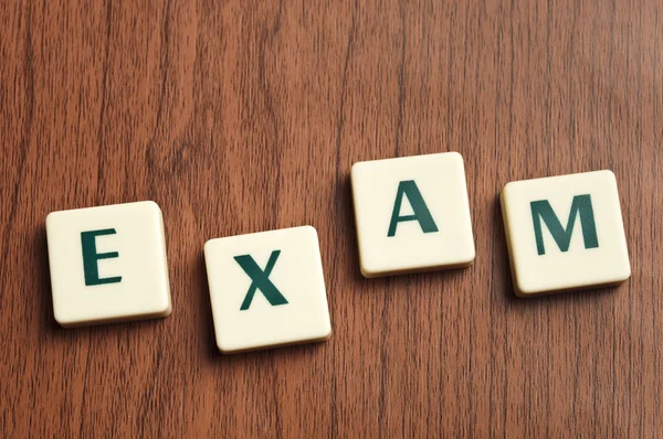 Exam word made by letter pieces — Stock Photo, Image