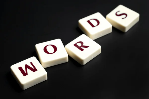 Palabras palabra hecha por piezas de letras — Foto de Stock
