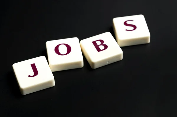 Jobs palavra feita por pedaços de letra — Fotografia de Stock
