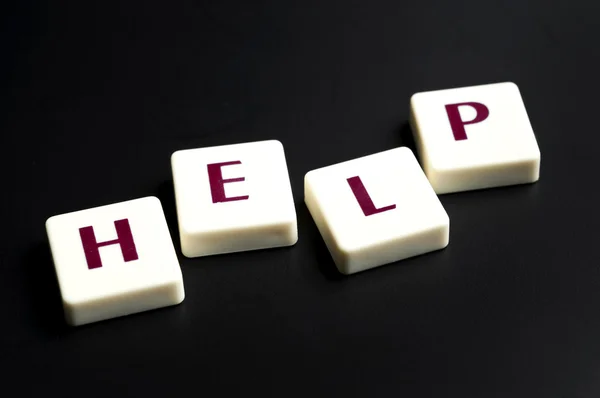 Help word made by letter pieces — Stock Photo, Image