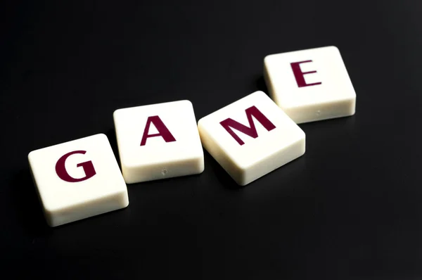 Palabra de juego hecha por piezas de letras — Foto de Stock