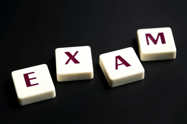 Exam word made by letter pieces — Stock Photo, Image