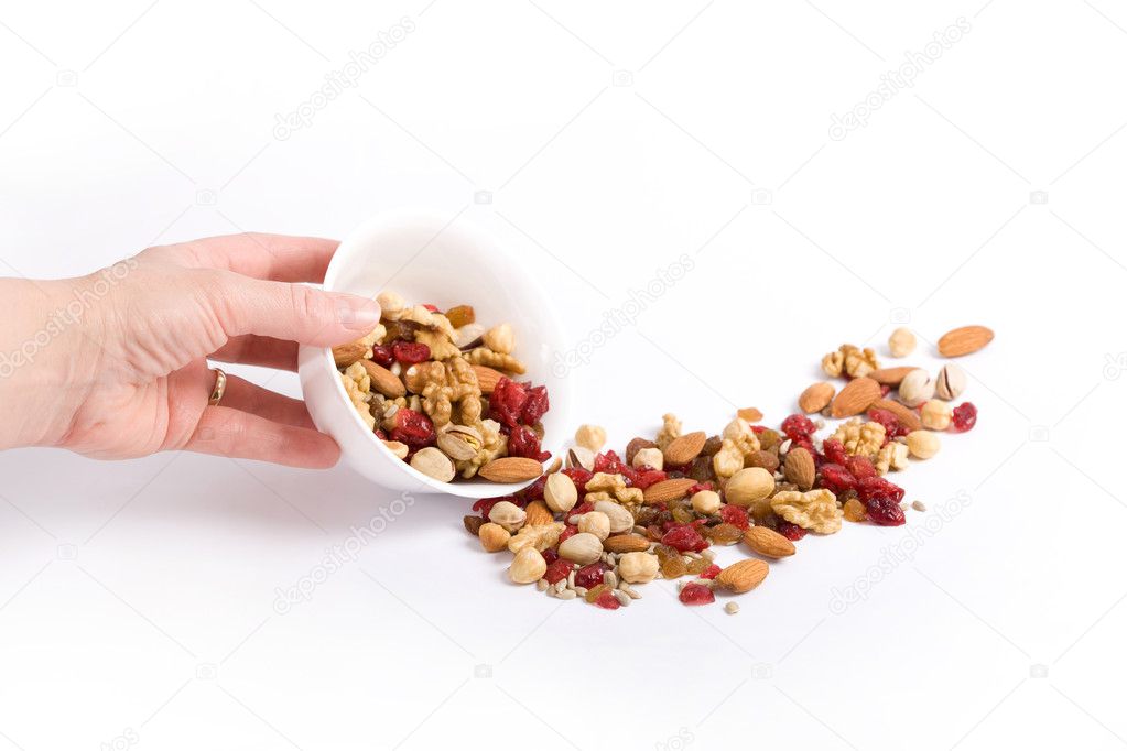 Cup of raw dried fruit on the table