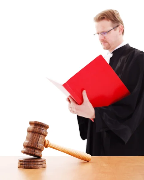 Justice gavel, judge reading in back — Stock Photo, Image