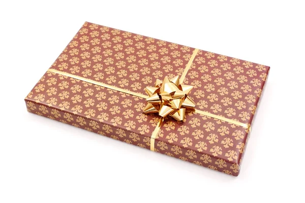 Подарочная коробка с золотым луком — стоковое фото