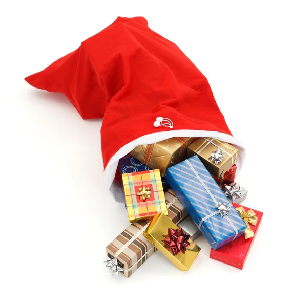 Varios regalos de Navidad que brotan de la bolsa de Santa — Foto de Stock