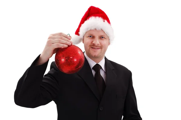 Affärsman visar röd jul prydnad — Stockfoto
