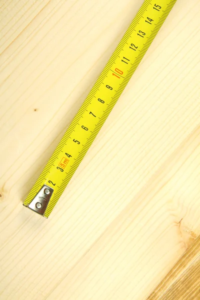 Ruler on a wooden background. — Stock Photo, Image