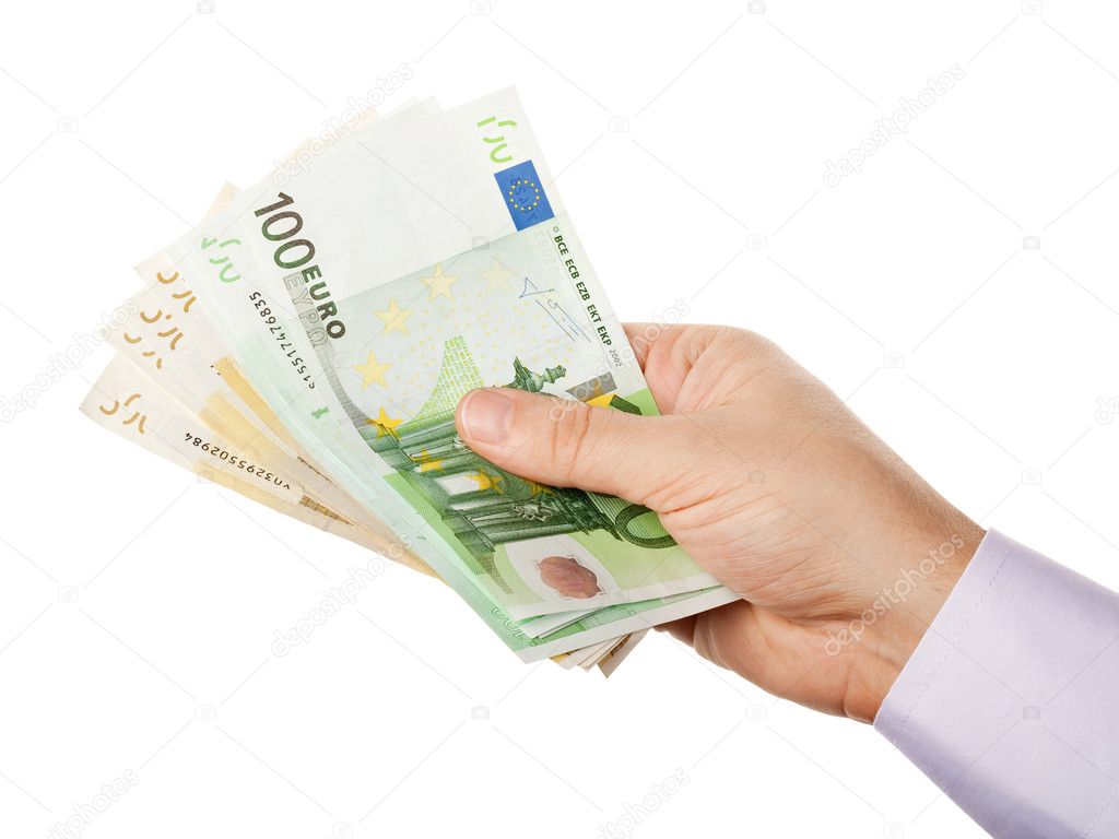 Businessman's hand holding bunch of money