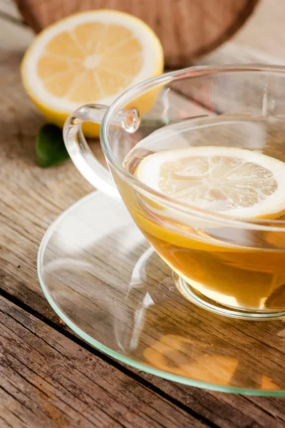 Cup of organic lemon fruit tea — Stock Photo, Image
