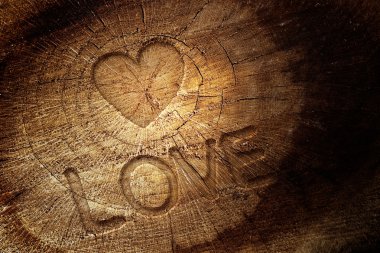 Love text on wooden background clipart