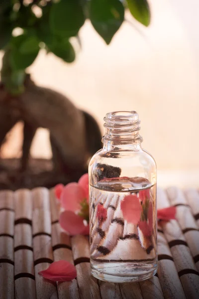 Spa setting with floral water — Stock Photo, Image