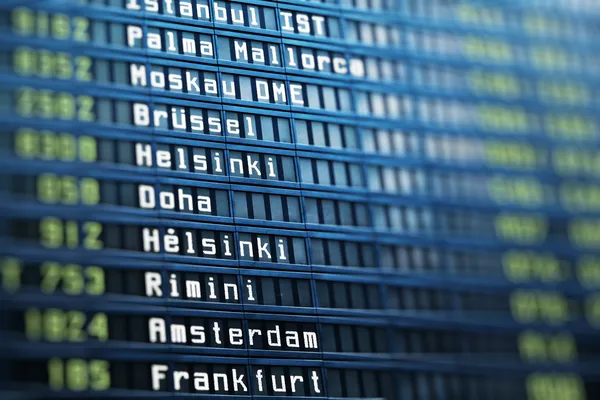 Flights information board in airport terminal — Stock Photo, Image