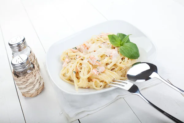 Italian pasta with smoked salmon — Stock Photo, Image