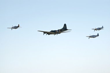 WWII planes fly in formation clipart