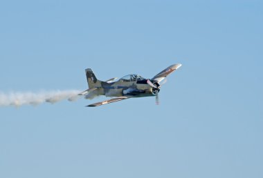 T-28 Fennec flies with smoke trail clipart